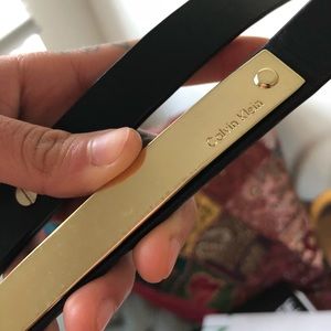 Calvin Klein gold and black belt